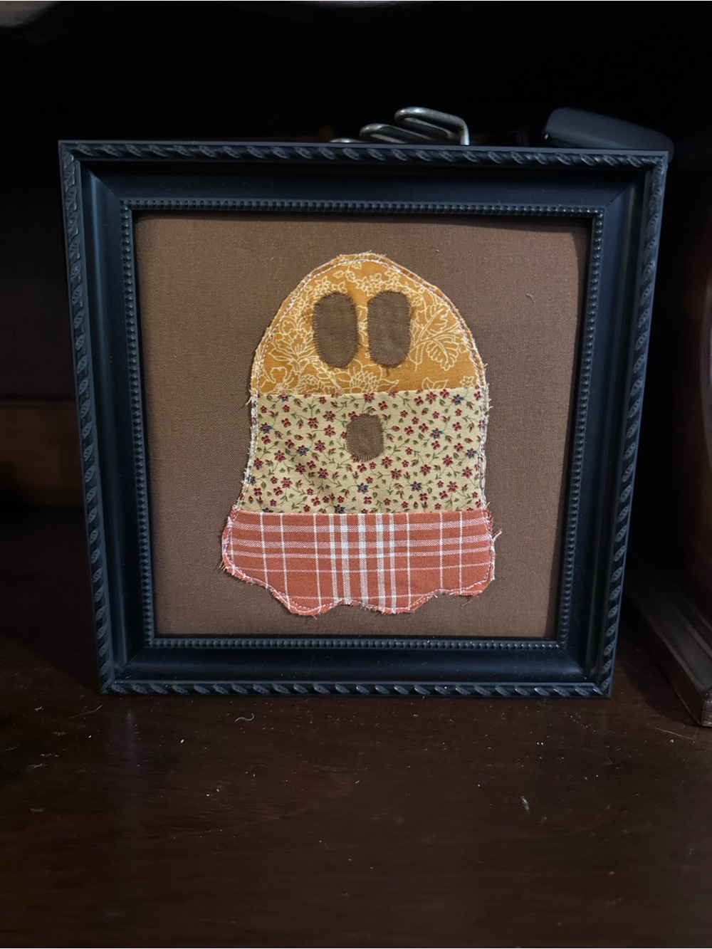 Framed Patchwork Ghost Wall Art in Brown, Orange, and Yellow